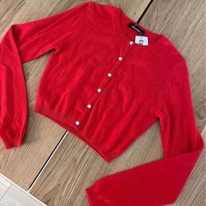 Editorial red sweater / cardigan